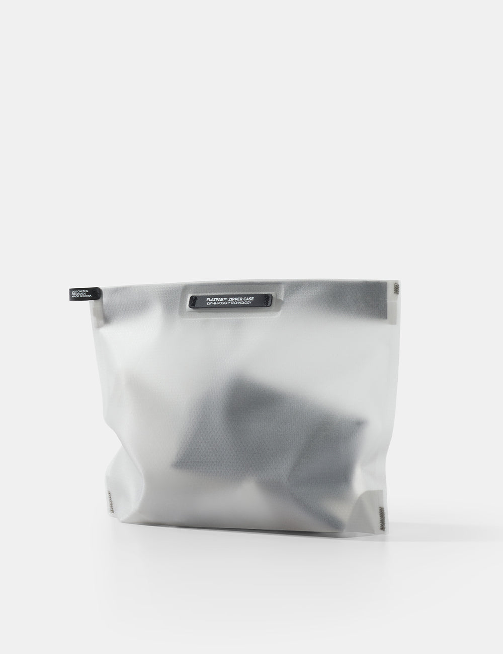 white toiletry case with a black zipper on a white background