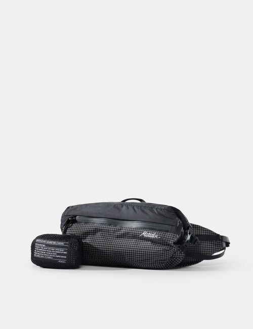 Black waist bag with visible brand logo on a white background