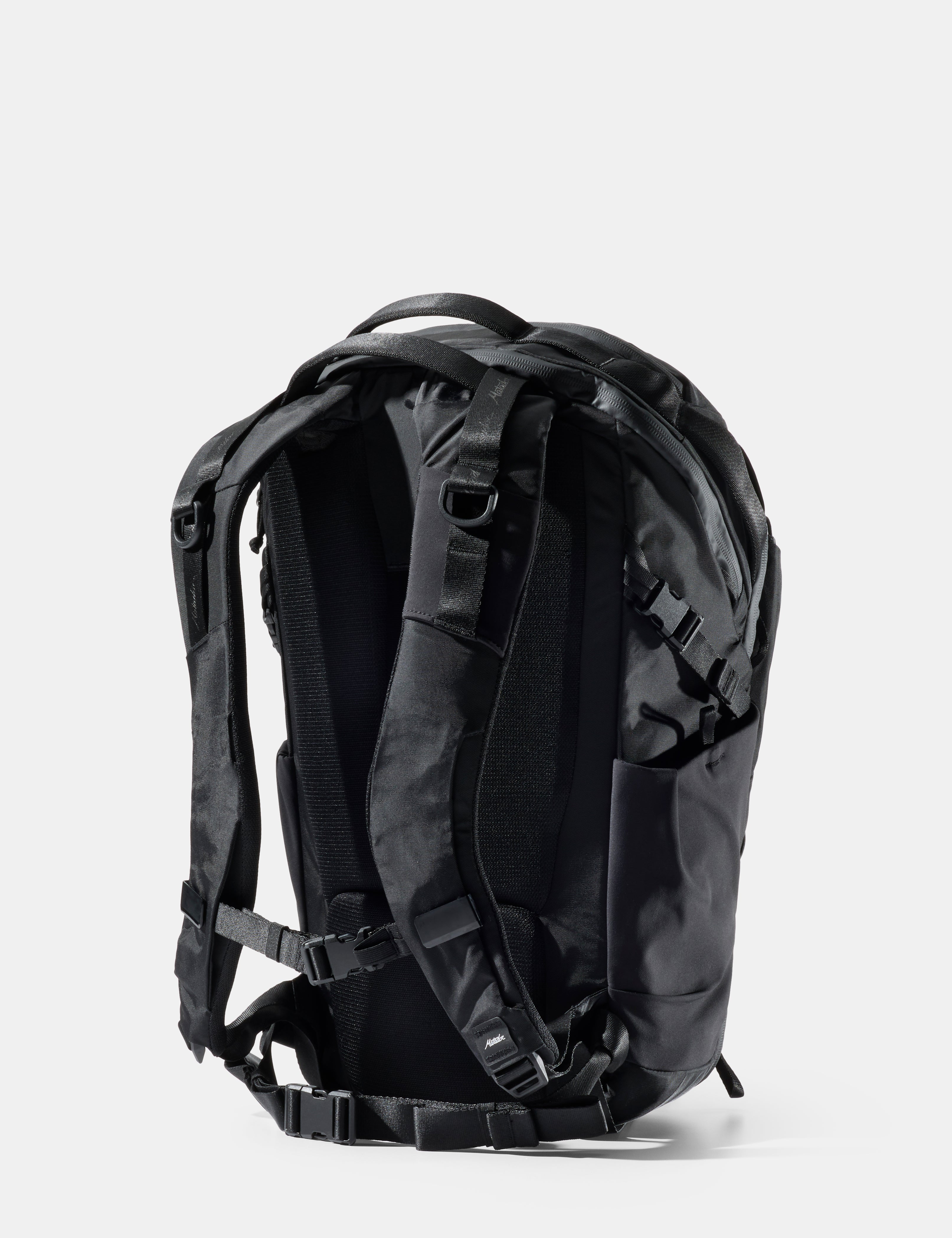 Black backpack on a light gray background