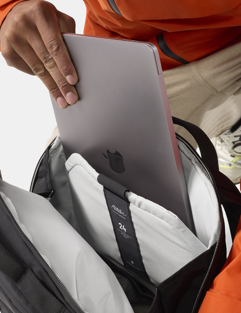 laptop being pulled out of backpack
