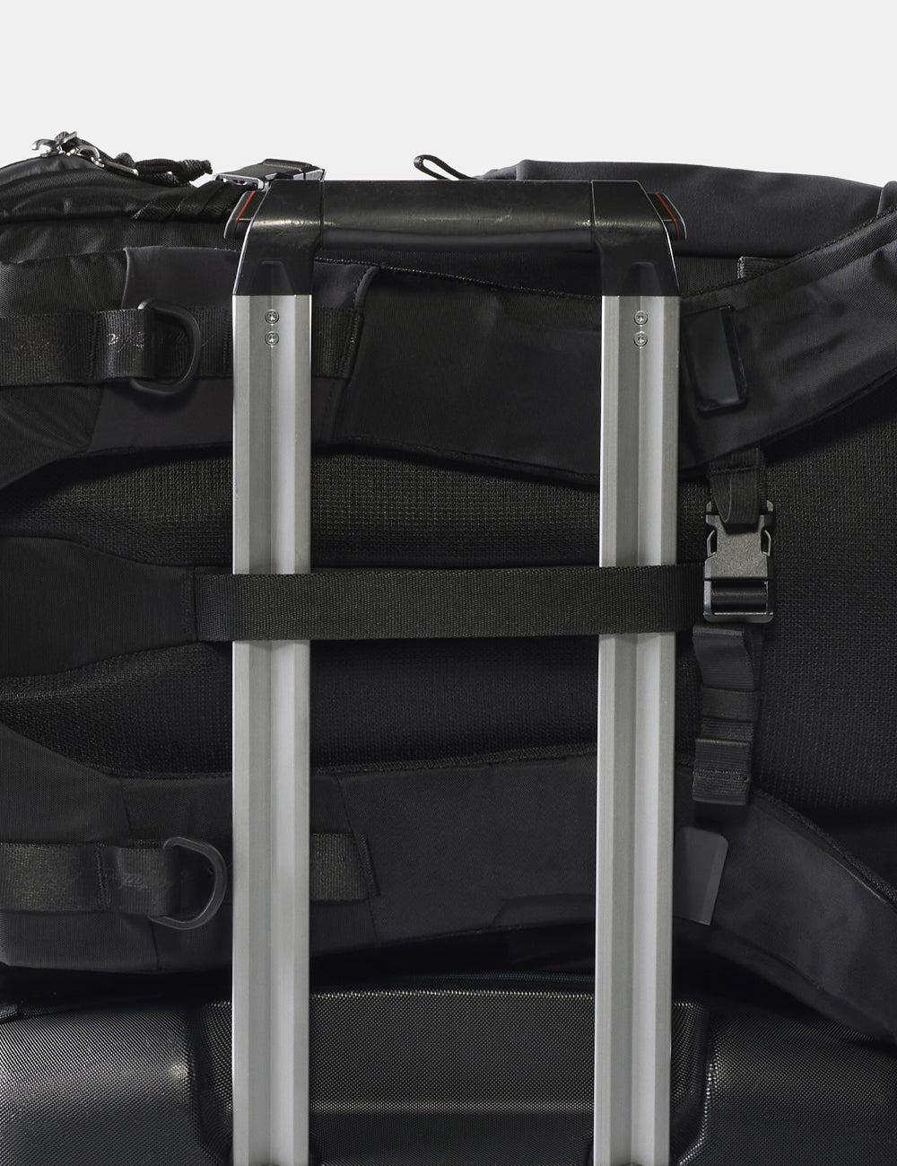 backpack on rolling luggage handle