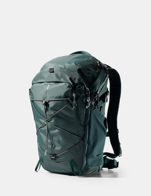 Green backpack on a white background