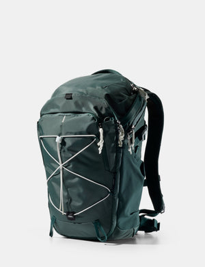 Green backpack on a white background