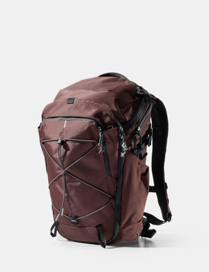 garnet backpack with black straps on a white background