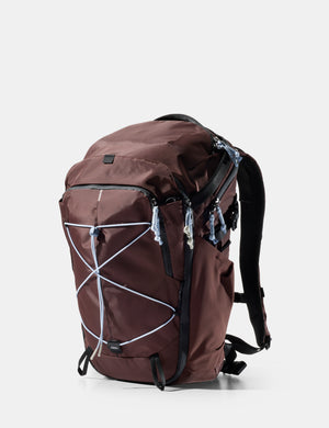 garnet backpack with light blue straps on a white background