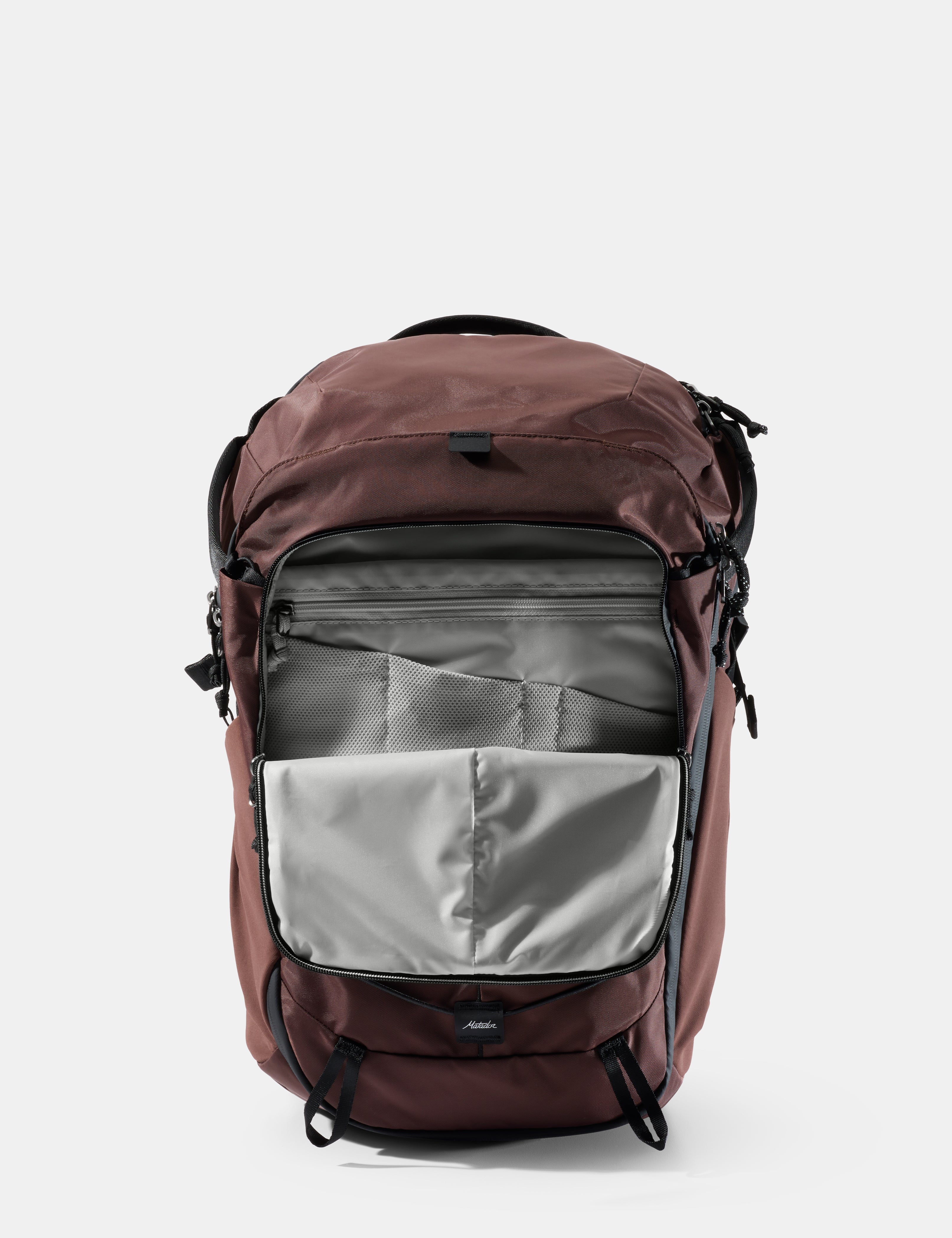 garnet backpack with open front pocket on a light gray background