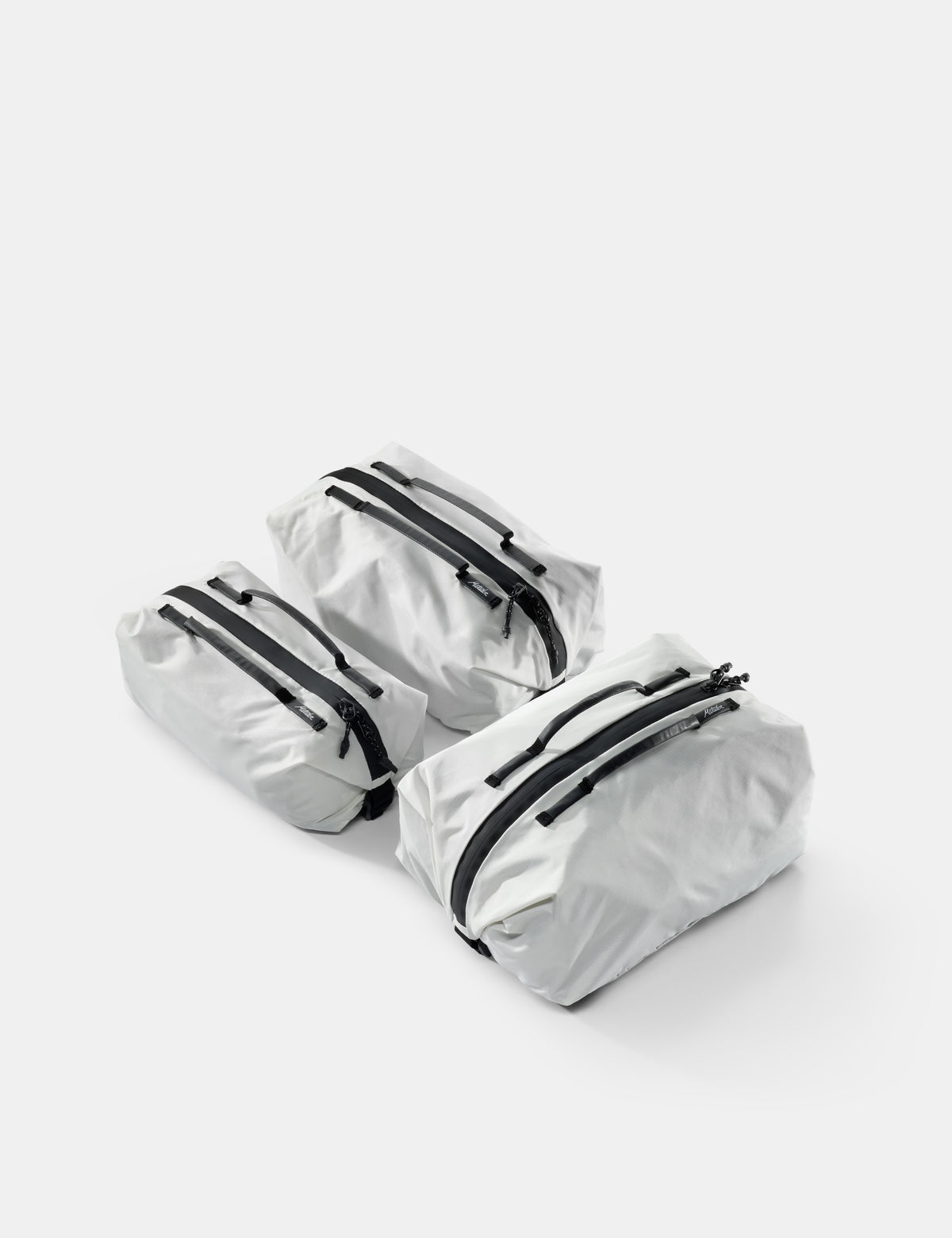 3 white gear cubes on white background