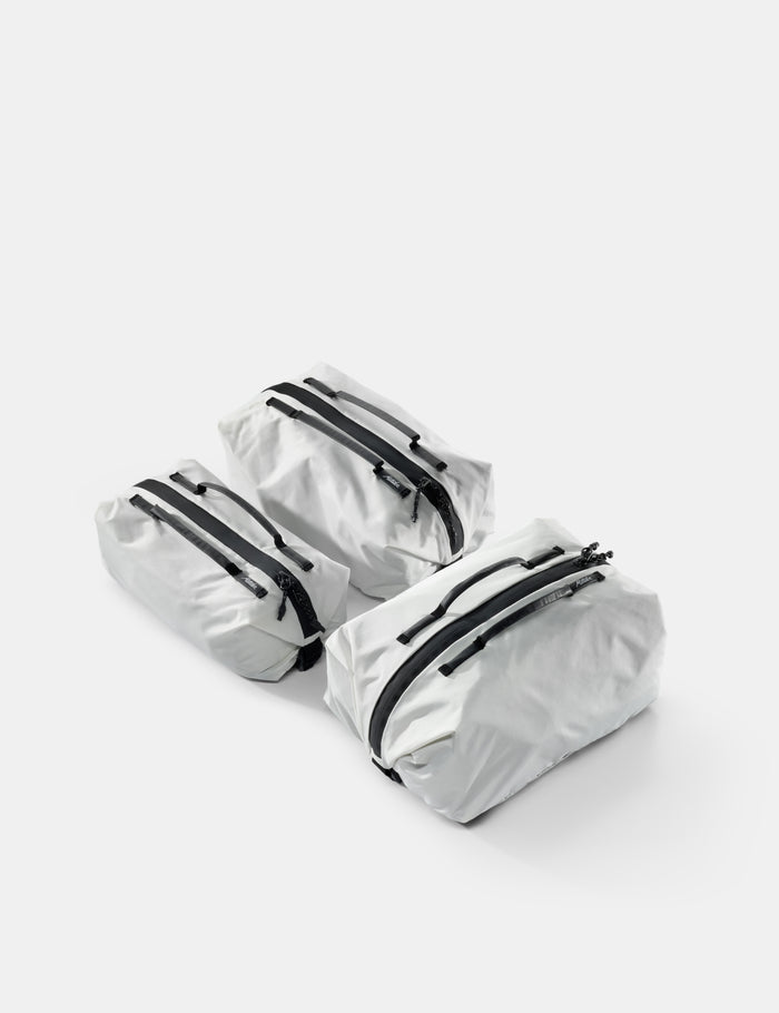 3 white gear cubes on white background