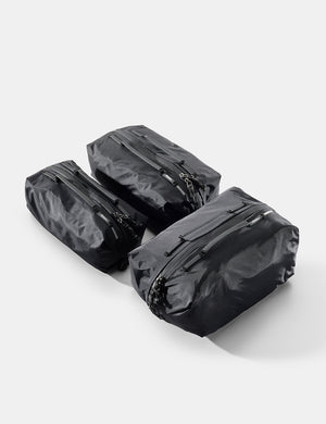 Three black gear cubes on a white background