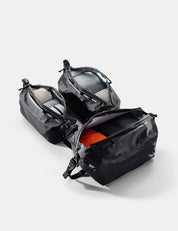 black gear cubes with open compartments on a light gray background