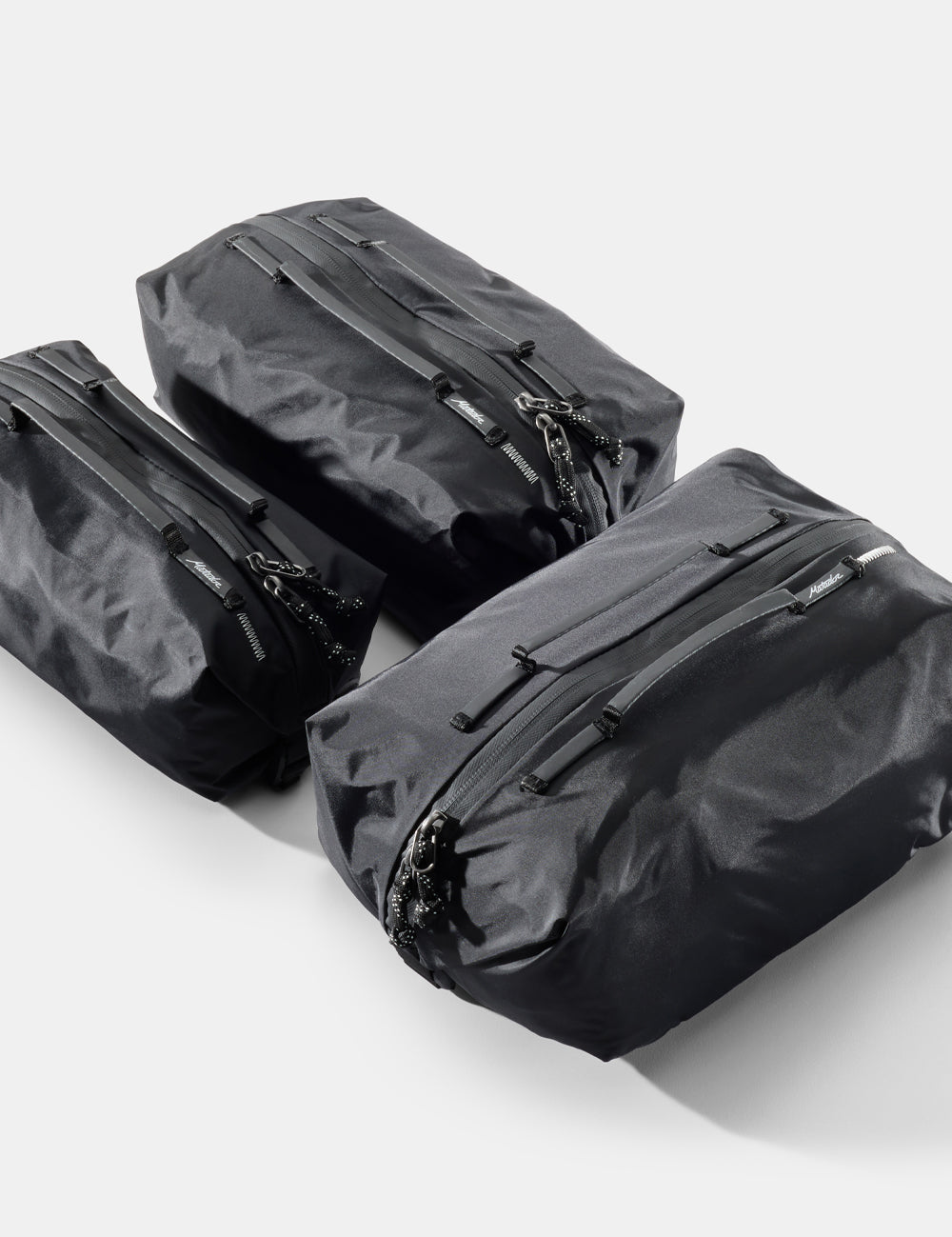 3 black gear cubes on white background