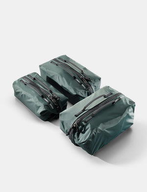 Three juniper gear cubes with zippers on a white background