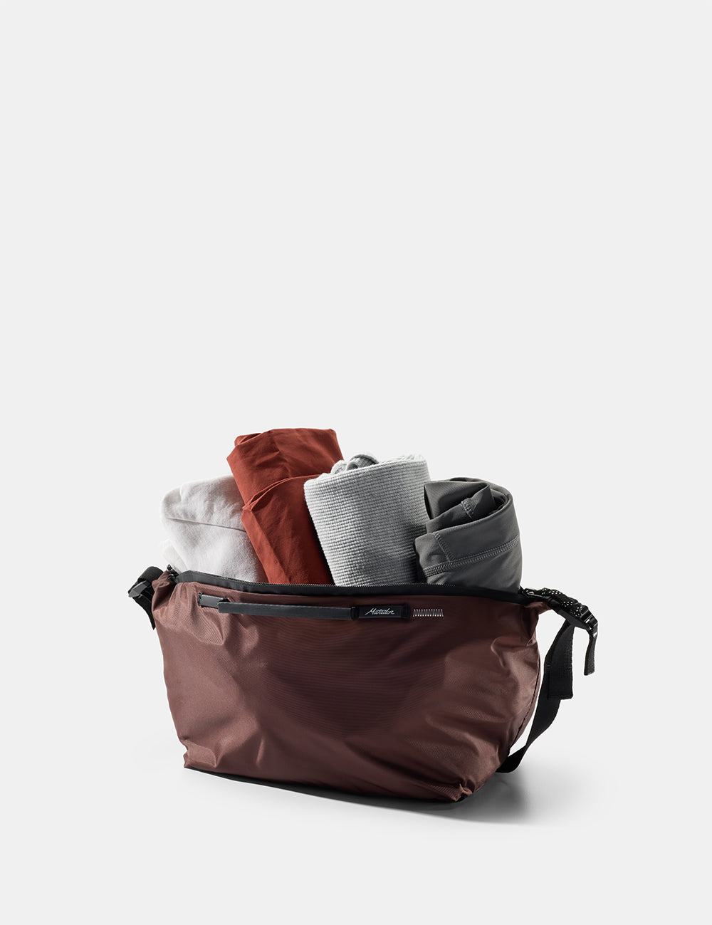 garnet gear cube with rolled clothing coming out