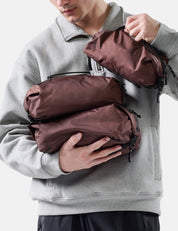 man holding garnet gear cubes