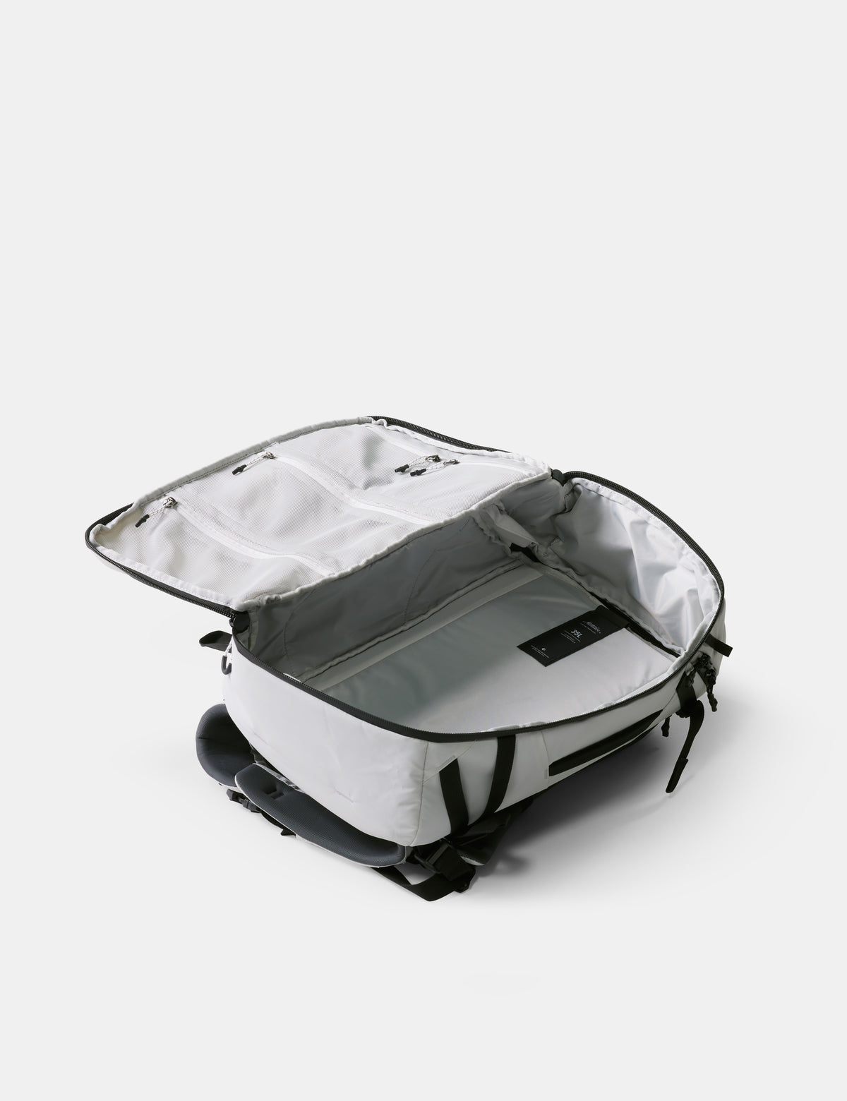 White suitcase with open lid on a white background