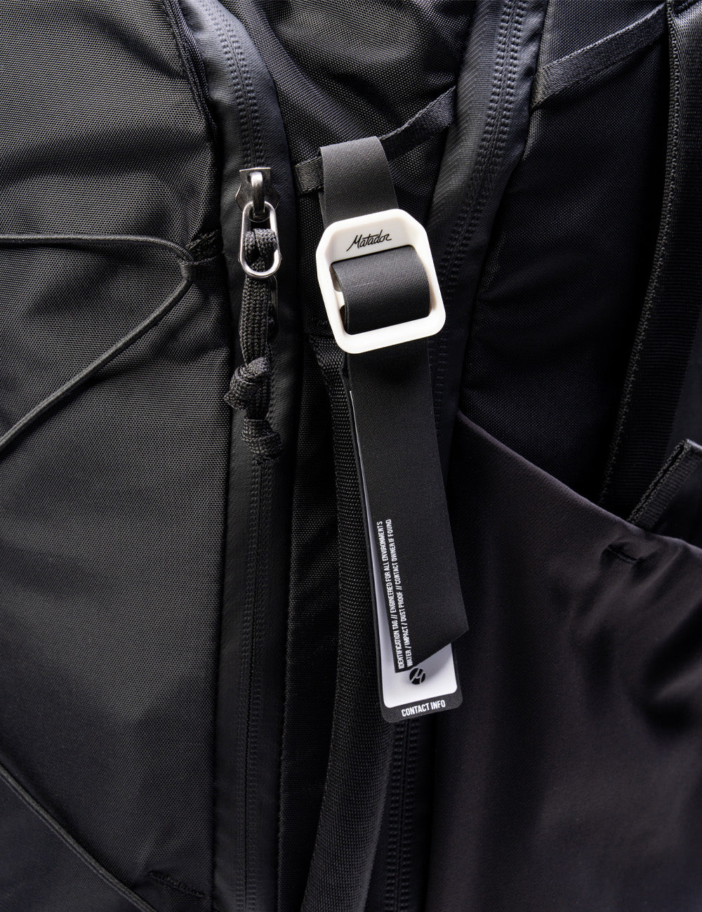 gear tag hanging off black bag