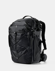 Black backpack on a light gray background