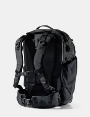 Black backpack on a light gray background