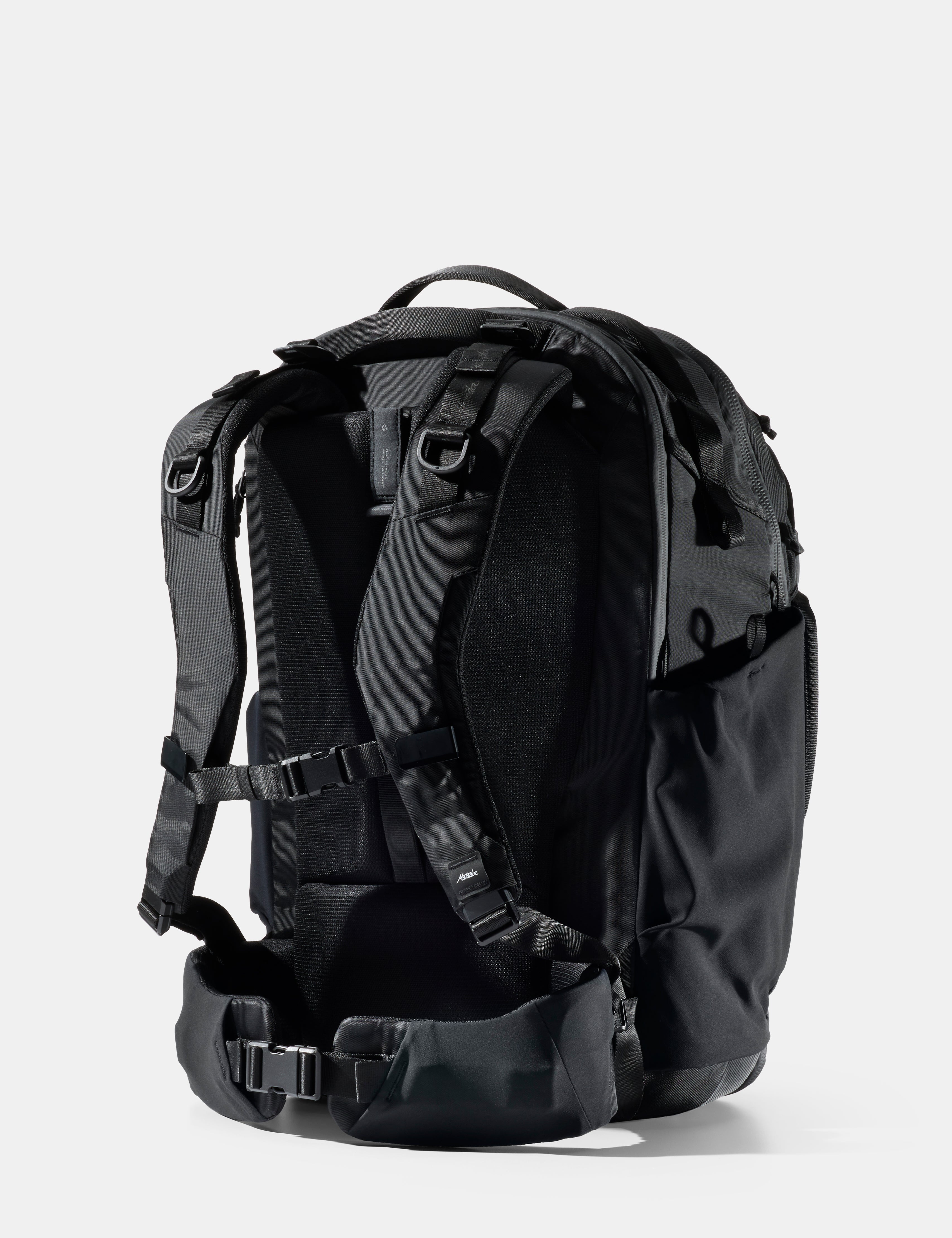 Black backpack on a light gray background