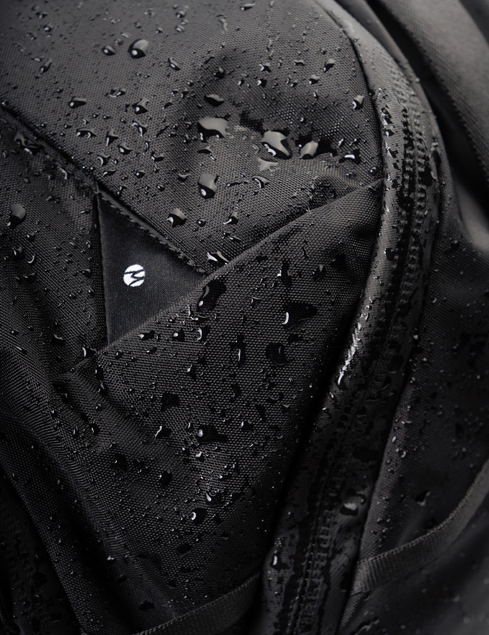 water droplets on black fabric