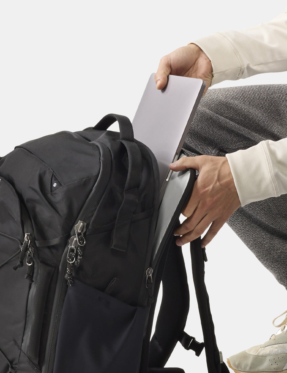 pulling laptop out of backpack