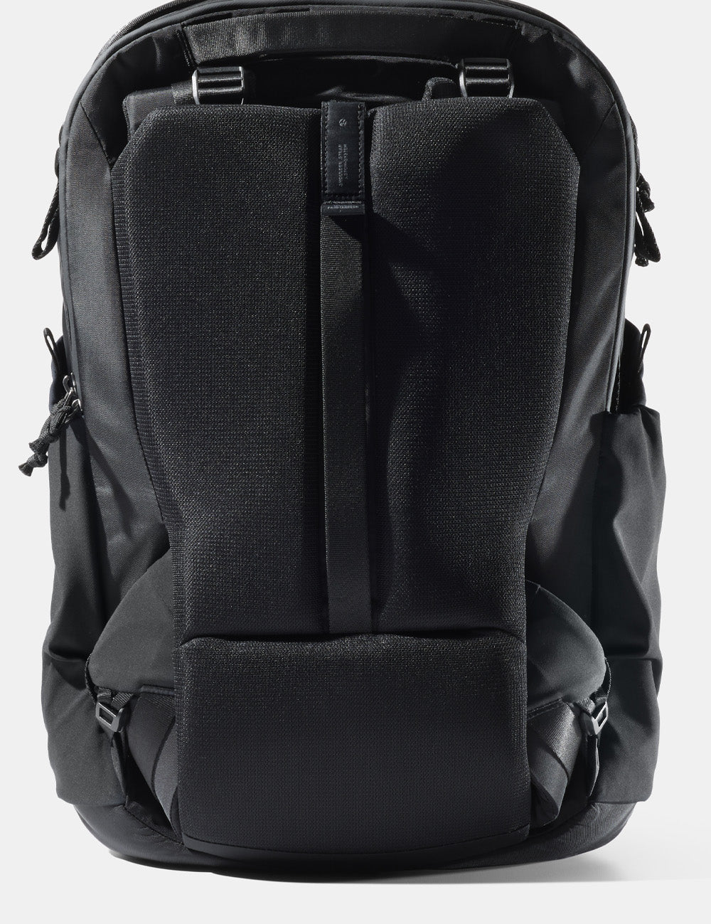 stowed straps on a black backpack