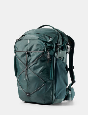 Green backpack on a white background