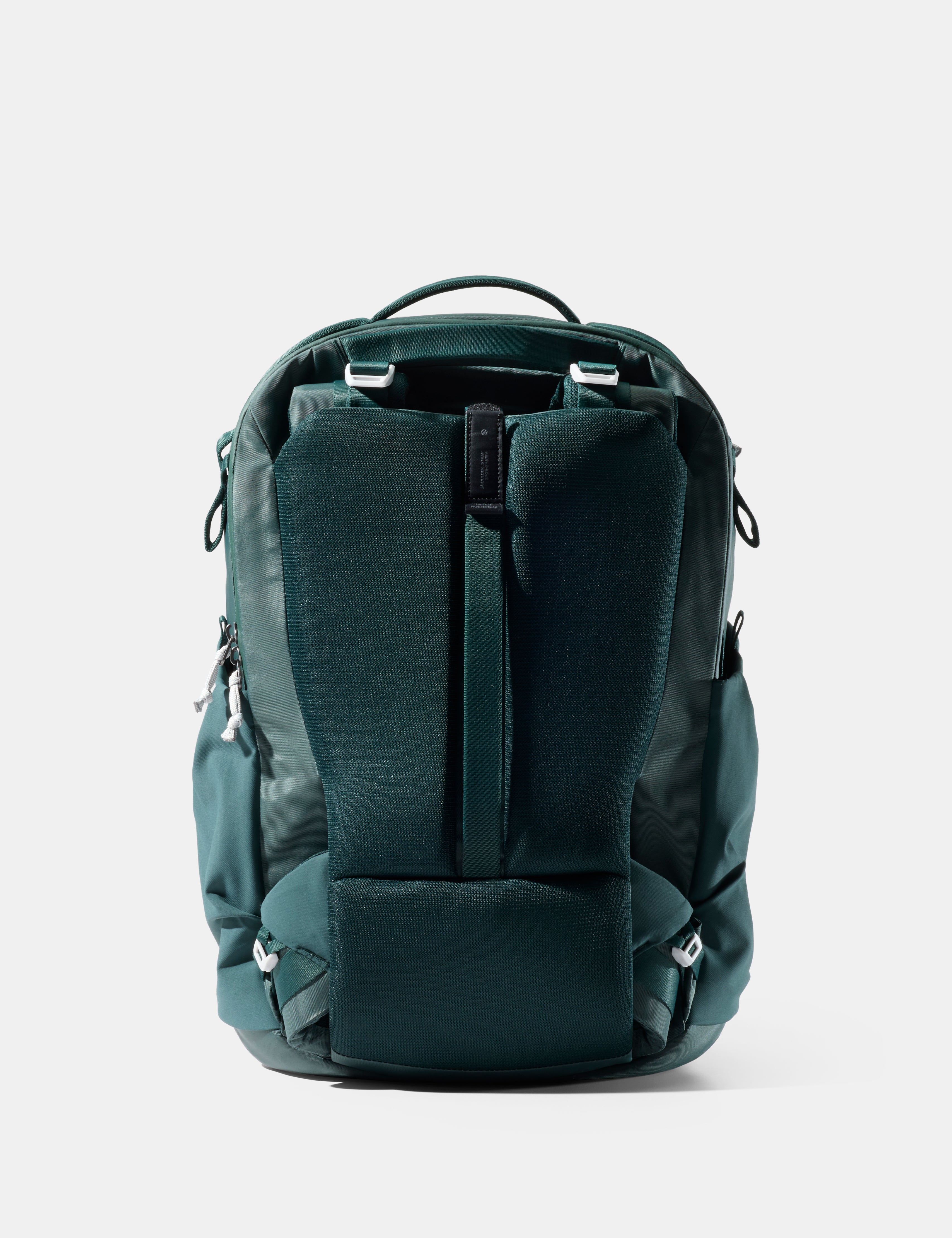 Green backpack on a light gray background