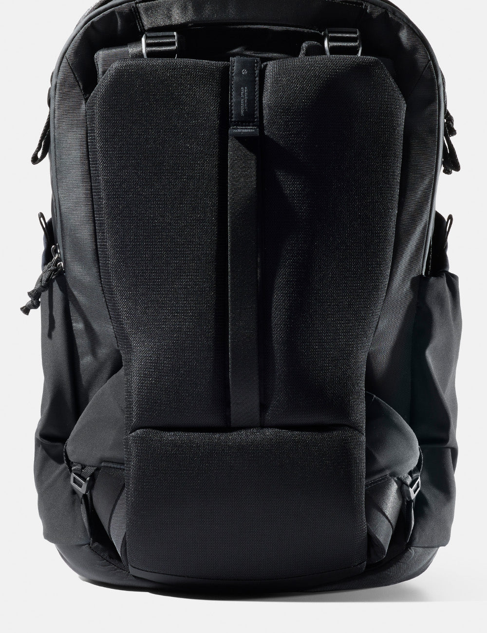 stowed straps on black backpack