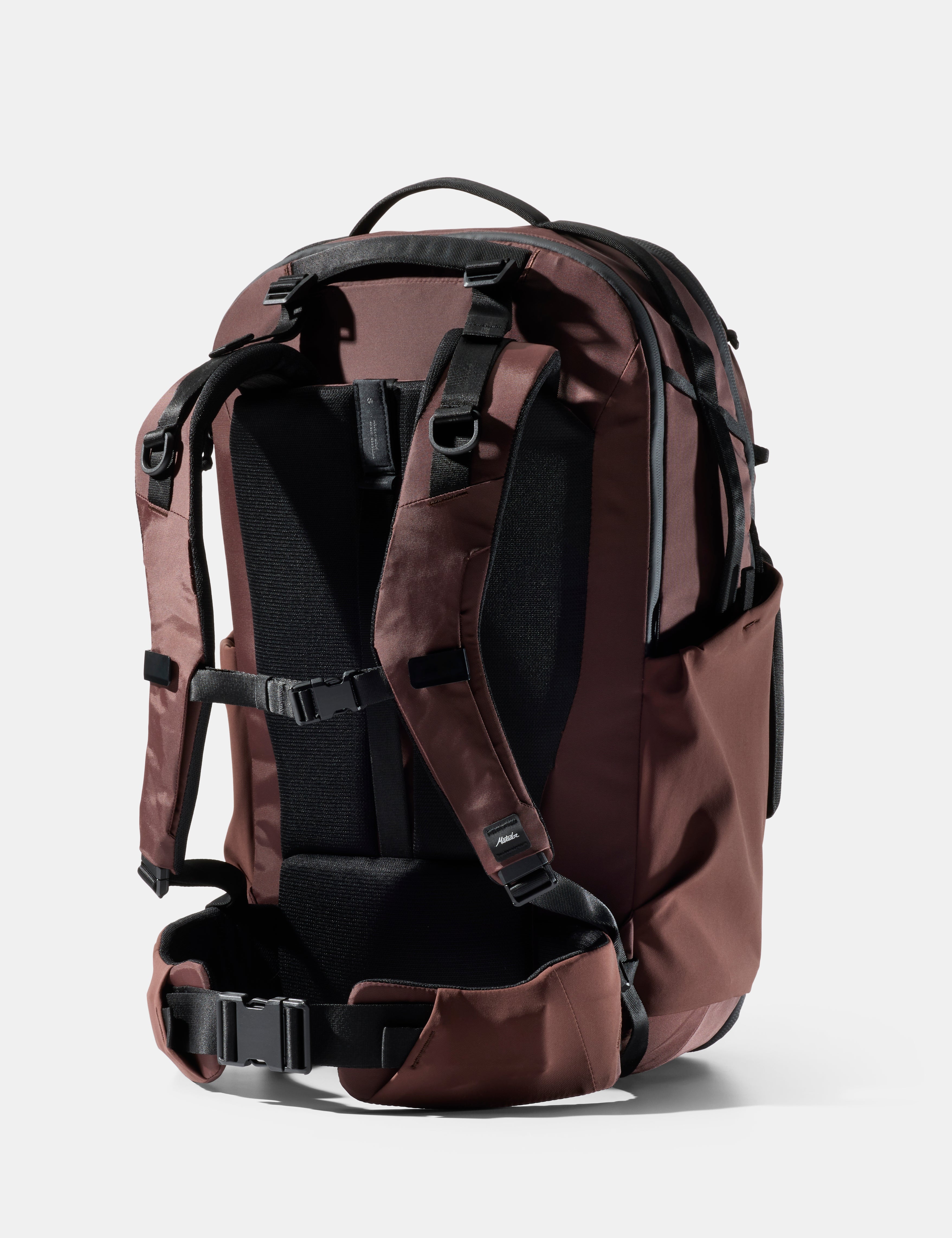 garnet backpack with black straps on a white background