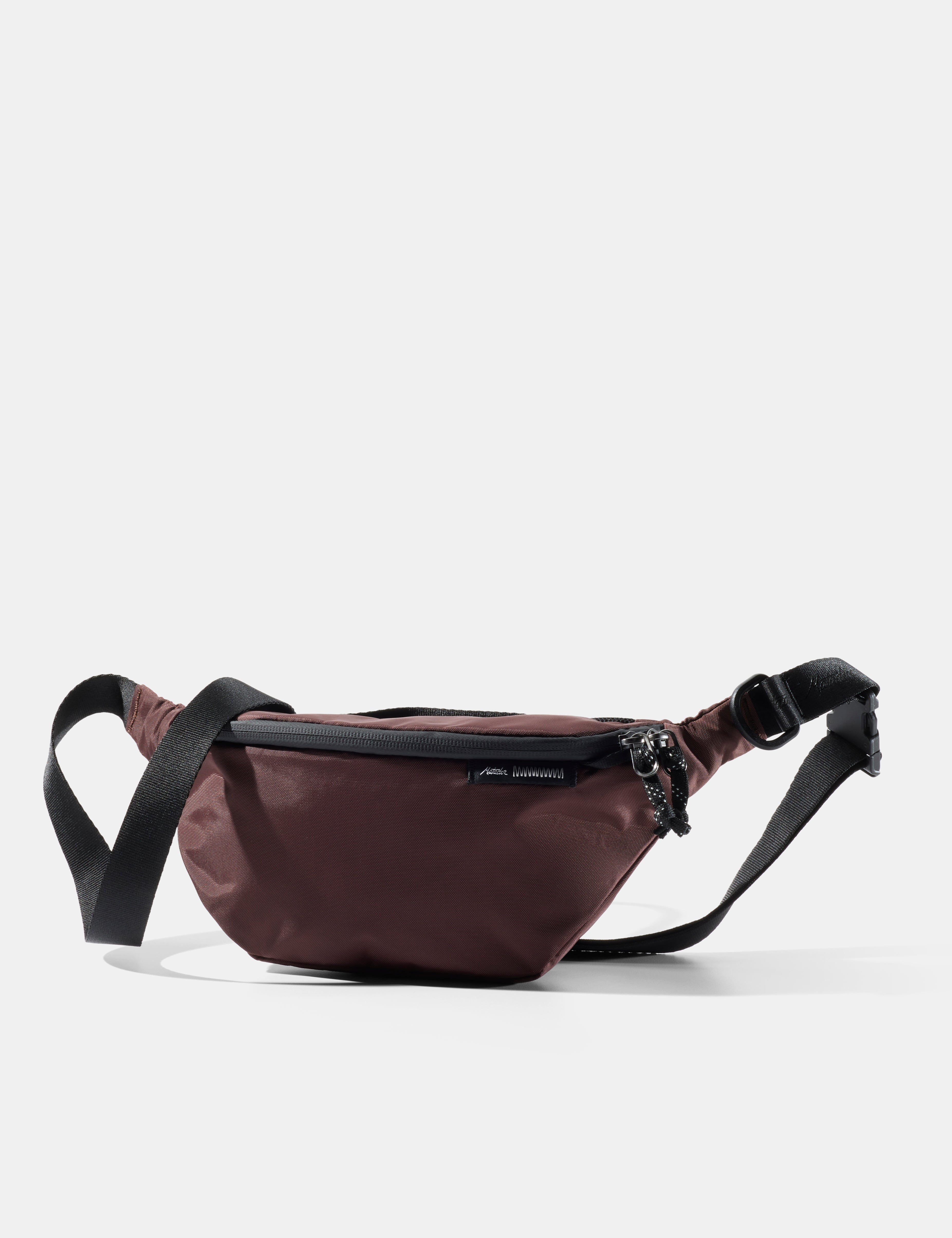 Garnet sling with black strap on a white background