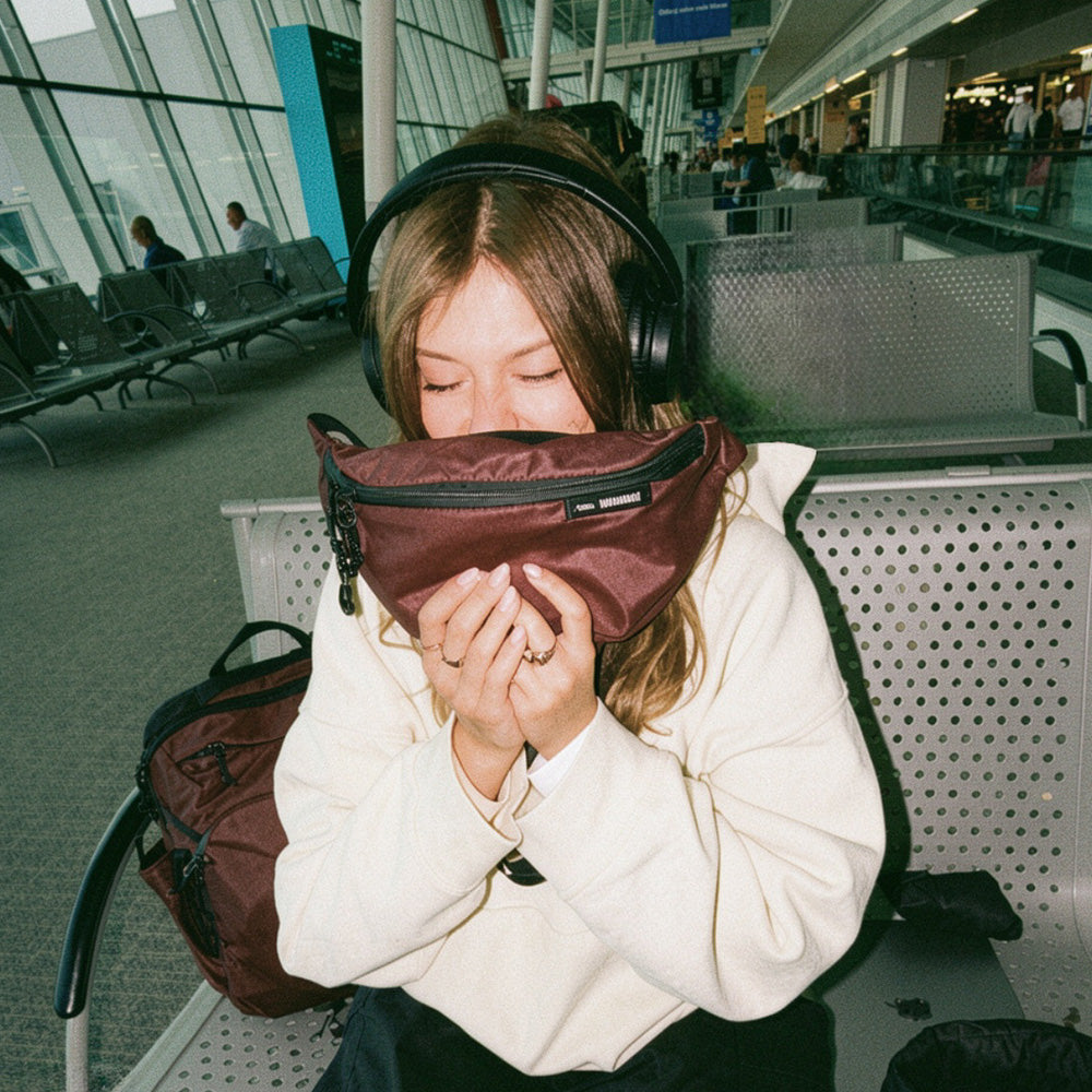 person in airport with garnet sling