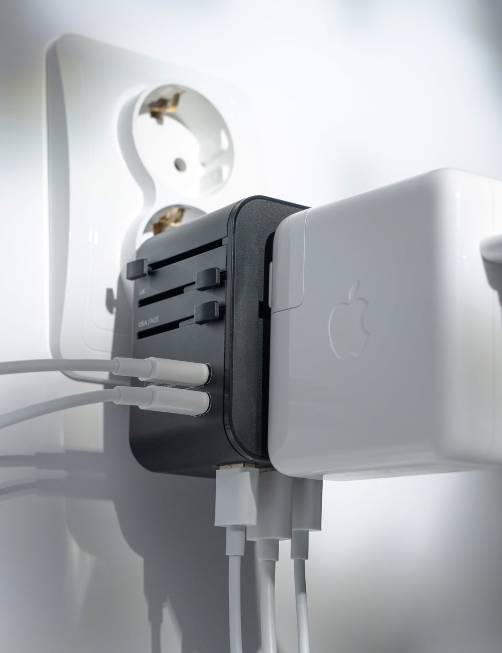 Travel Adapter plugged into a European wall outlet