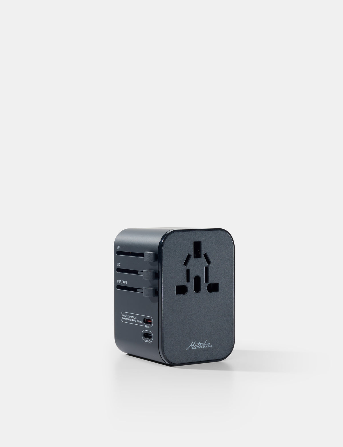 Black travel adapter on a white background