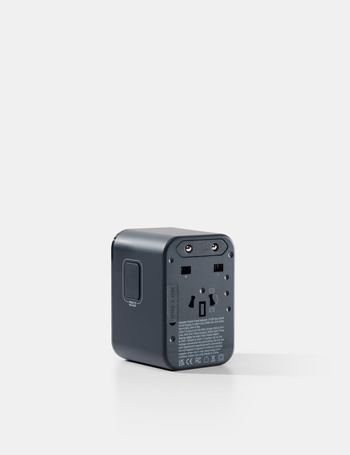 Black travel adapter on a white background