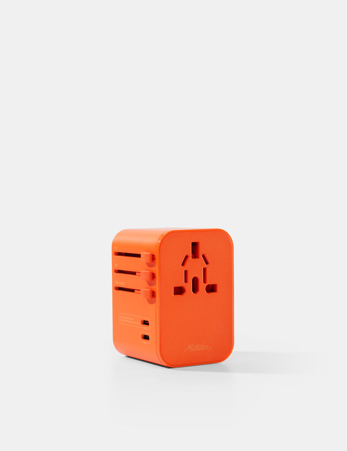 Orange travel adapter on a white background