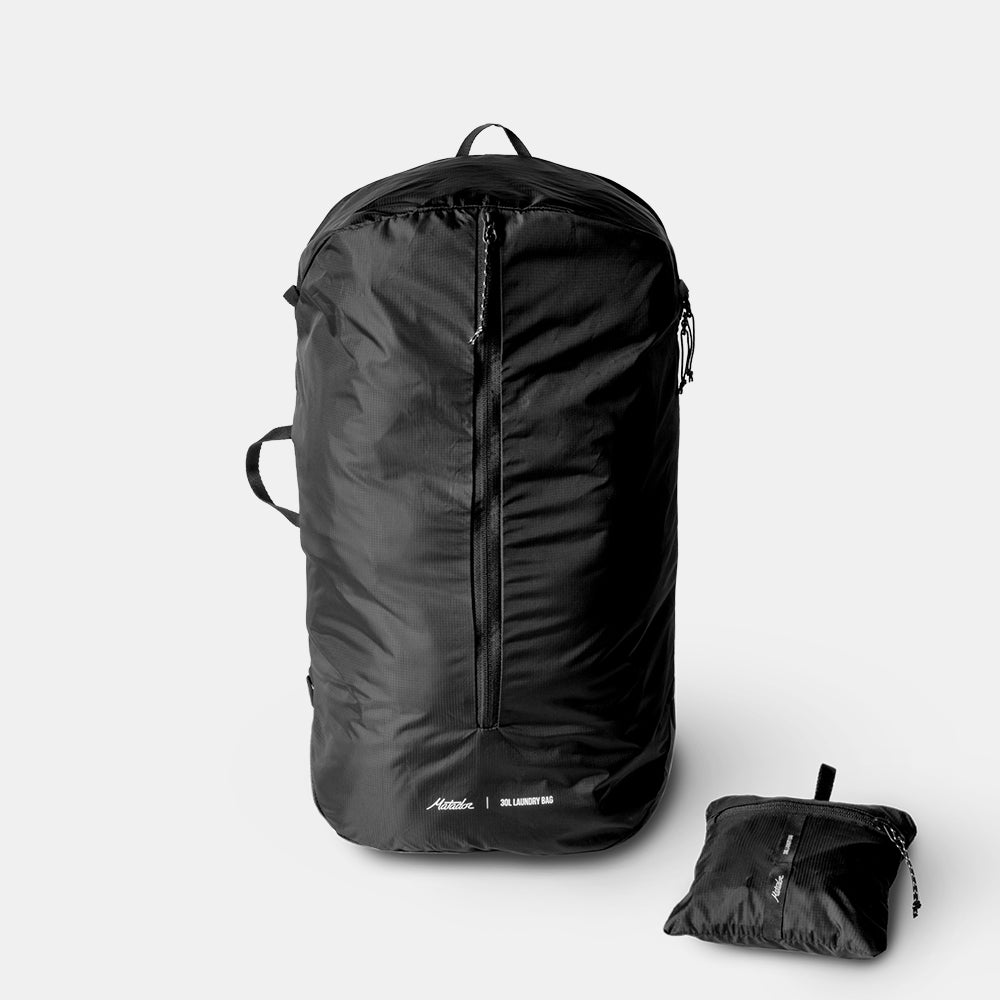 Full sized and Packed up packable laundry bag  on light gray background