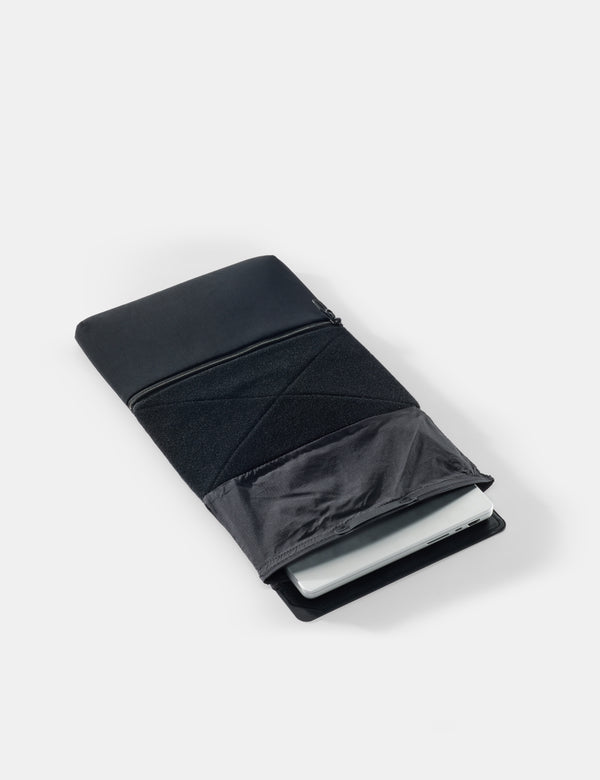 laptop base layer with computer on a white surface