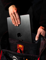 placing laptop into backpack