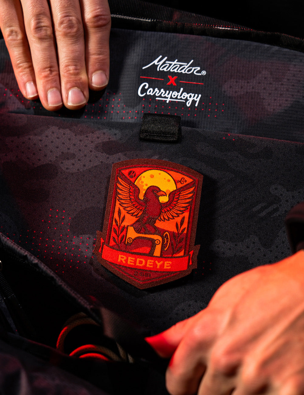 red raven patch inside of backpack
