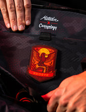 red raven patch inside of backpack