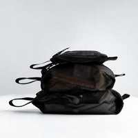 all 3 mesh bag sizes filled and stacked on top of each other on white studio background