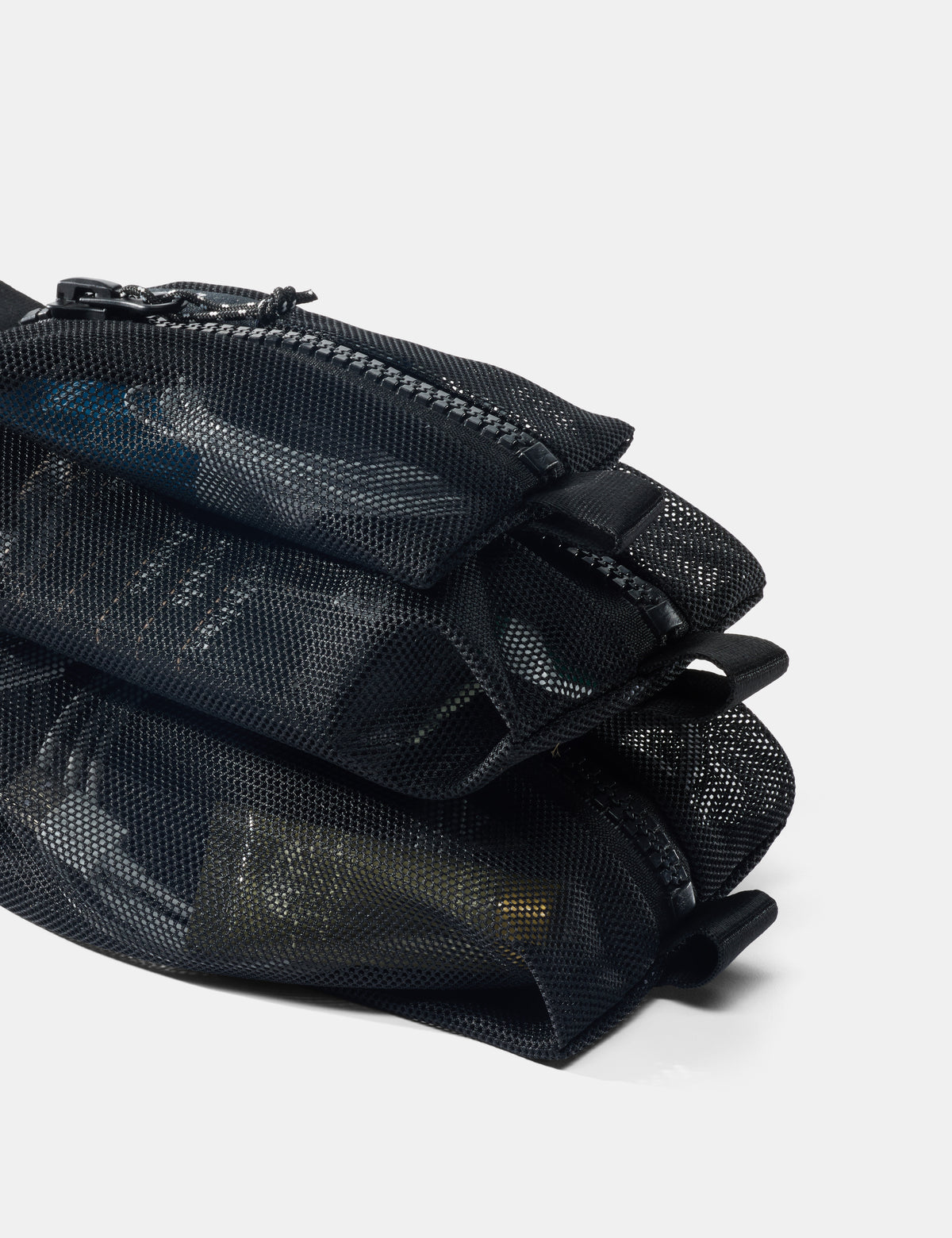 Black mesh pouch with zippers on a white background