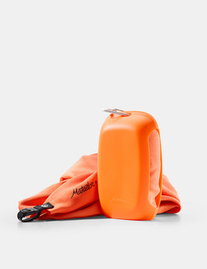 orange silicone case and towel on white background