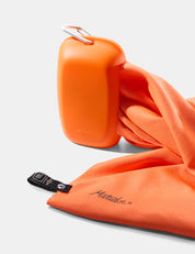 orange silicone case and orange towel on white background