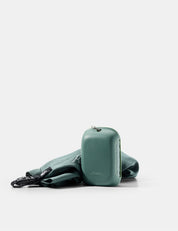 green silicone case and towel on white background