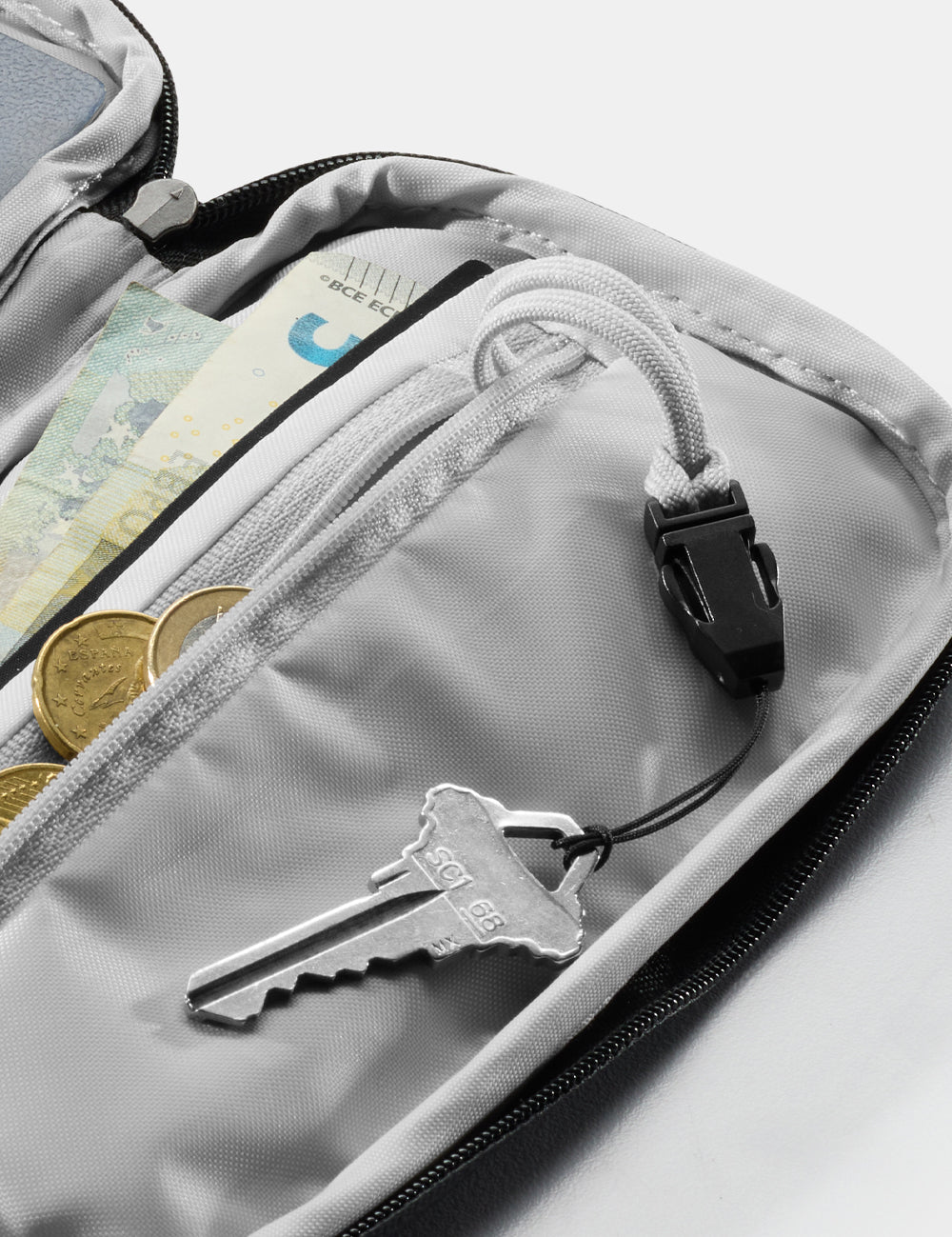 close up view of detachable key holder in travel wallet 