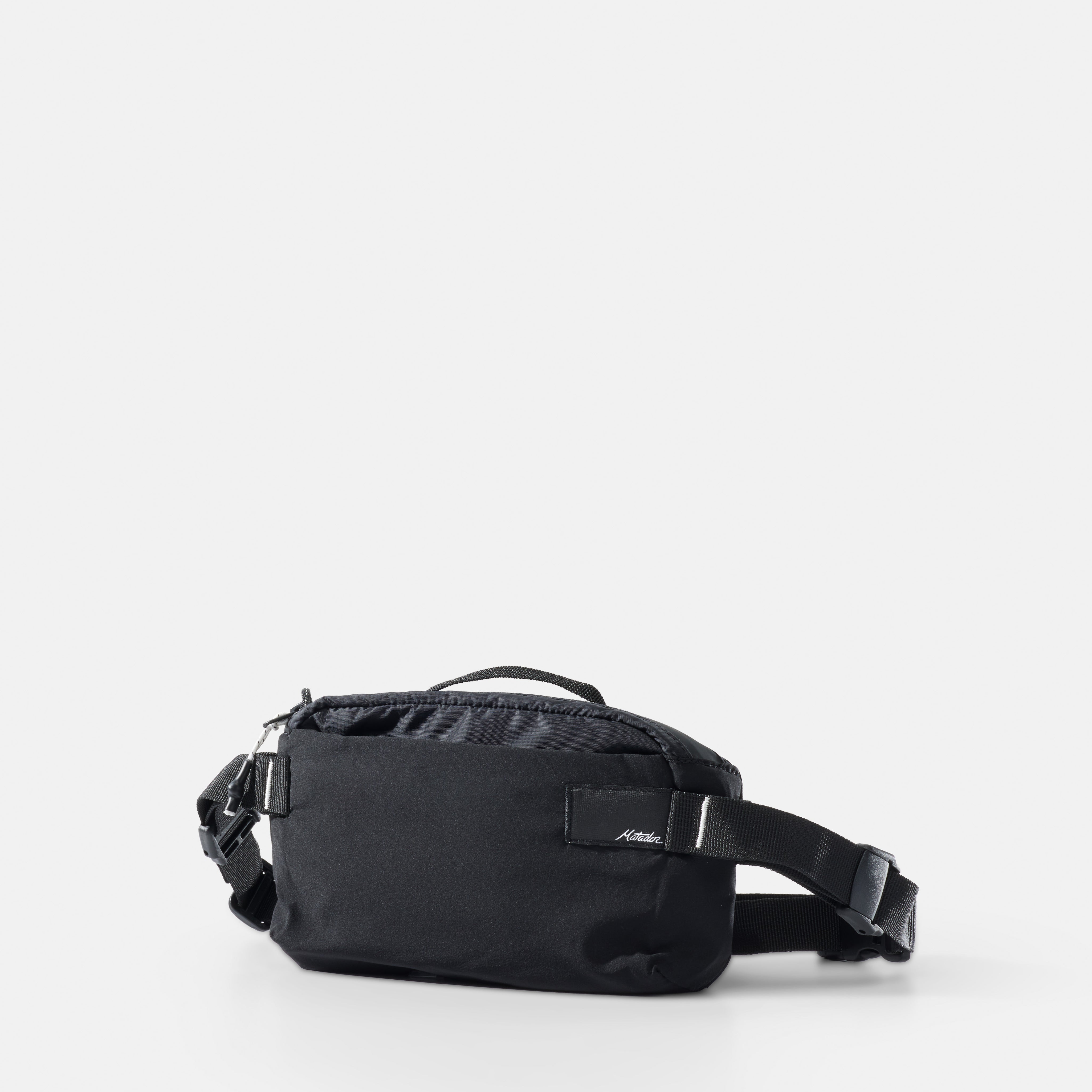 Black waist bag on a light gray background