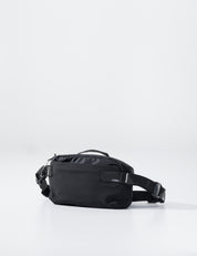 Black waist bag on a light gray background