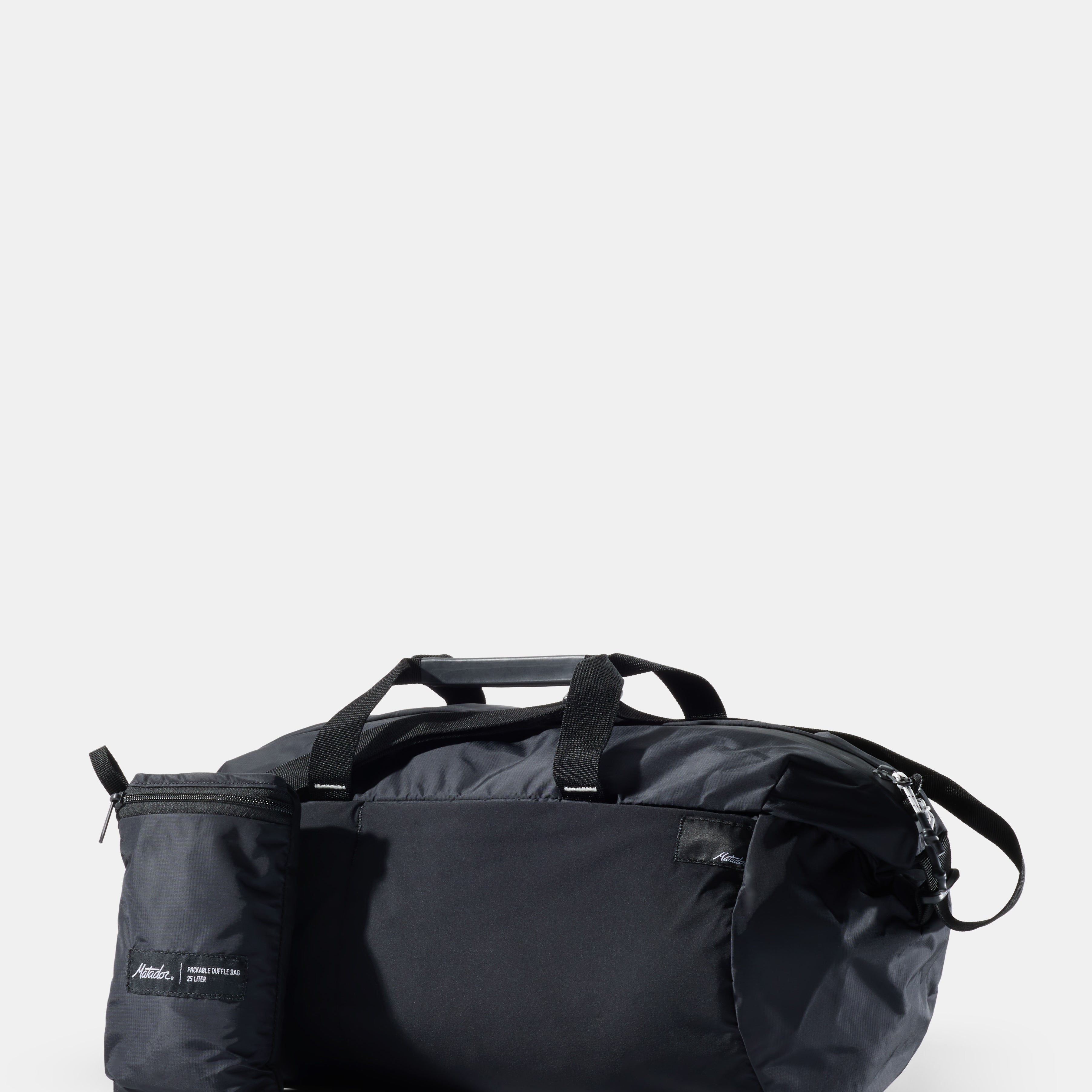 Black duffel bag on a white background